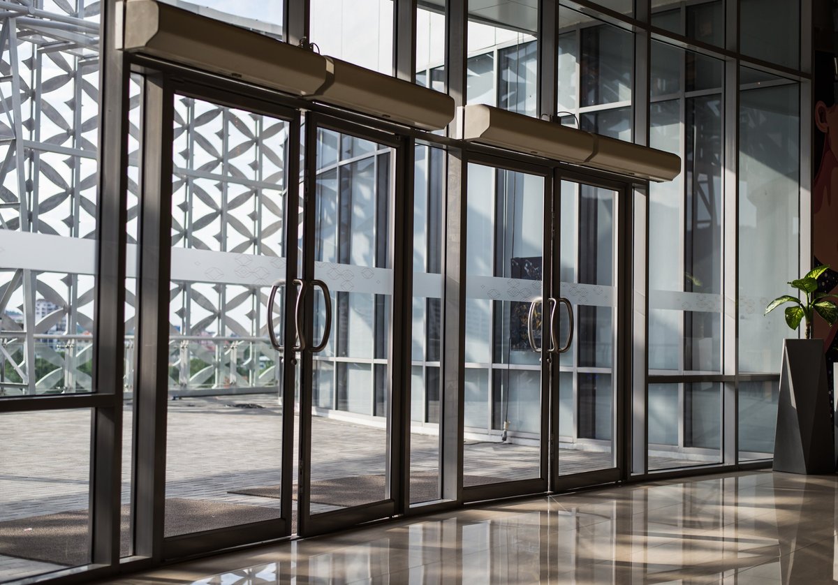 Modern commercial office building lobby with glass entrance